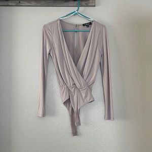 Extremely flattering low cut body suit size xs